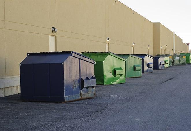 a row of blue construction dumpsters on a job site in Flossmoor